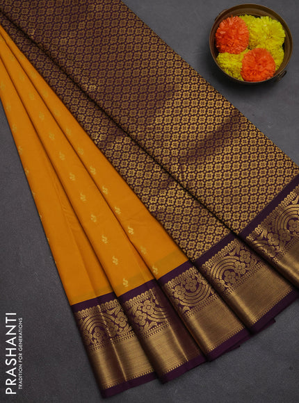 Semi kanchipuram silk saree mustard yellow and purple with allover zari woven buttas and rich zari woven border