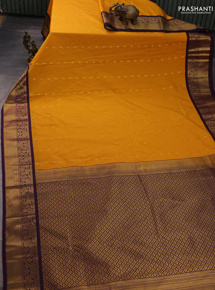 Semi kanchipuram silk saree mustard yellow and purple with allover zari woven buttas and rich zari woven border