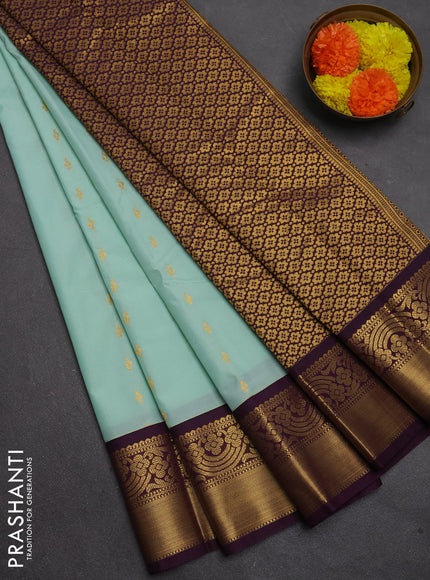 Semi kanchipuram silk saree mild teal green and purple with allover zari woven buttas and rich zari woven border