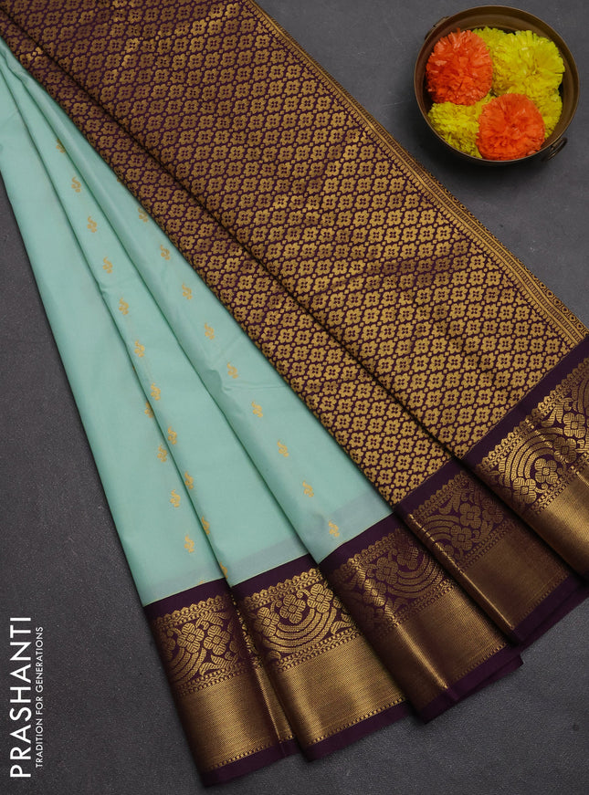 Semi kanchipuram silk saree mild teal green and purple with allover zari woven buttas and rich zari woven border