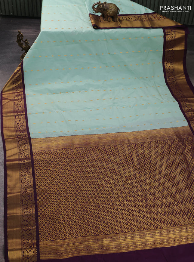 Semi kanchipuram silk saree mild teal green and purple with allover zari woven buttas and rich zari woven border