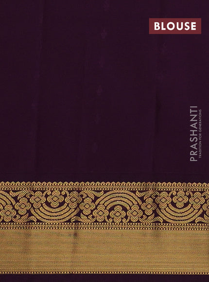 Semi kanchipuram silk saree mild teal green and purple with allover zari woven buttas and rich zari woven border