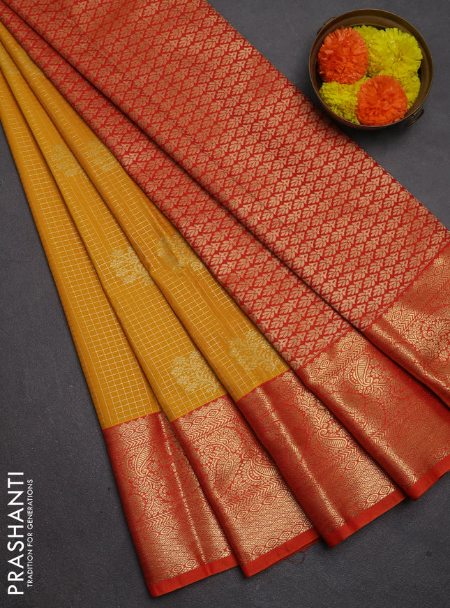 Semi kanchipuram silk saree mustard yellow and orange with allover zari checks & buttas and long zari woven border