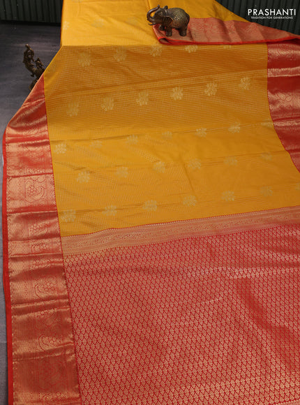 Semi kanchipuram silk saree mustard yellow and orange with allover zari checks & buttas and long zari woven border