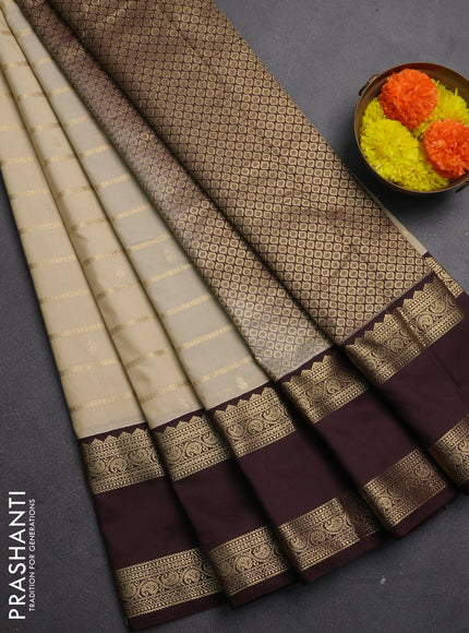 Semi kanchipuram silk saree beige and coffee brown with allover zari weaves & buttas and rettapet zari woven korvai border
