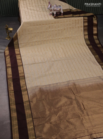 Semi kanchipuram silk saree beige and coffee brown with allover zari weaves & buttas and rettapet zari woven korvai border