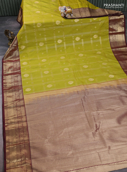 Semi kanchipuram silk saree mehendi green and maroon shade with allover zari checks & buttas and zari woven border