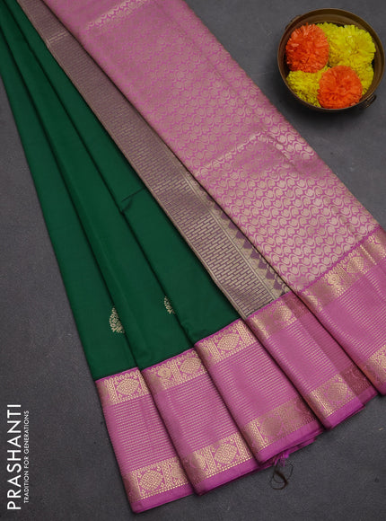 Semi kanchipuram silk saree green and lotus pink with zari woven buttas and zari woven korvai border