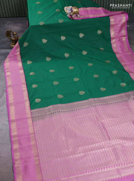 Semi kanchipuram silk saree green and lotus pink with zari woven buttas and zari woven korvai border