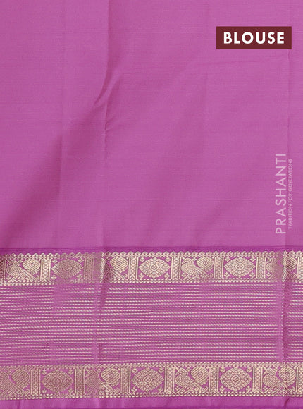 Semi kanchipuram silk saree green and lotus pink with zari woven buttas and zari woven korvai border