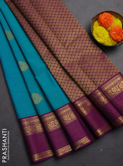 Semi kanchipuram silk saree teal blue and purple with zari woven buttas and zari woven korvai border