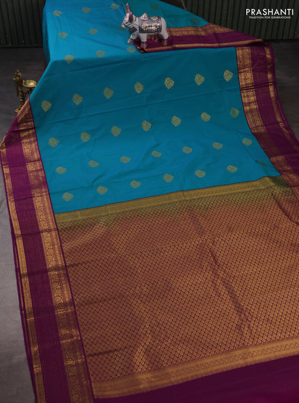 Semi kanchipuram silk saree teal blue and purple with zari woven buttas and zari woven korvai border