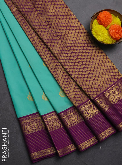 Semi kanchipuram silk saree teal green and purple with zari woven buttas and zari woven korvai border