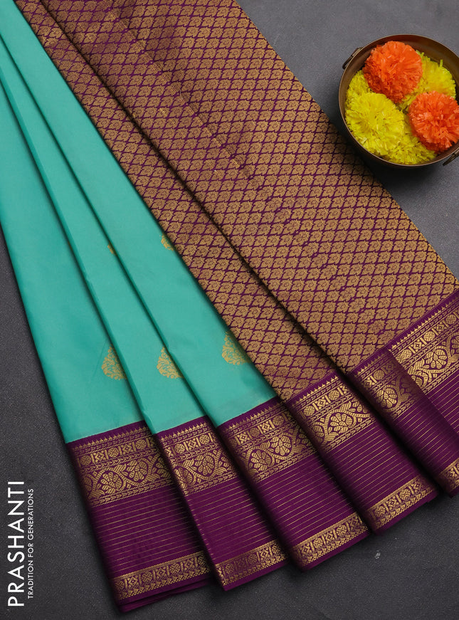 Semi kanchipuram silk saree teal green and purple with zari woven buttas and zari woven korvai border