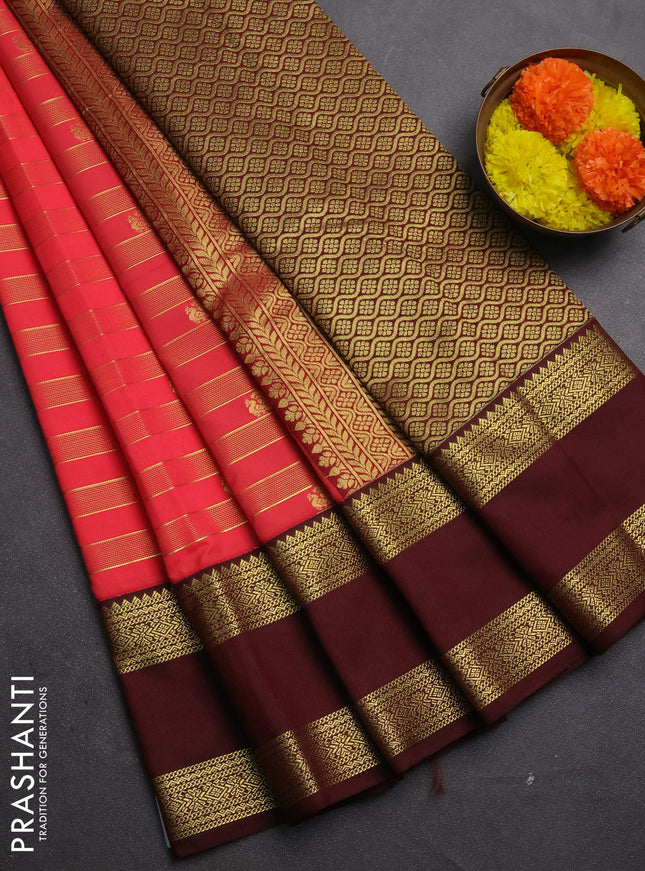 Semi kanchipuram silk saree dual shade of pinkish orange and deep maroon with allover zari weaves & buttas and rettapet zari woven border
