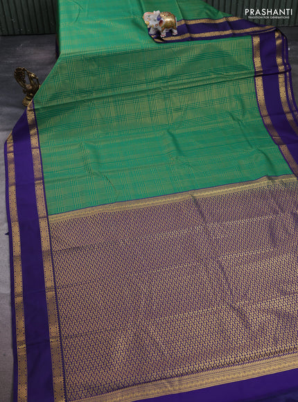 Semi kanchipuram silk saree green and navy blue with allover small zari checked pattern and rettapet zari woven border