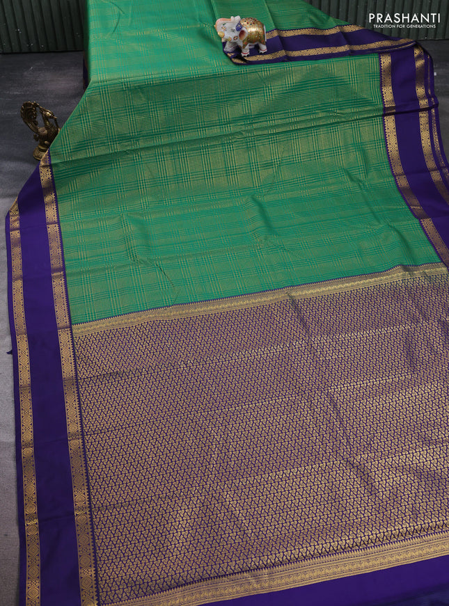 Semi kanchipuram silk saree green and navy blue with allover small zari checked pattern and rettapet zari woven border