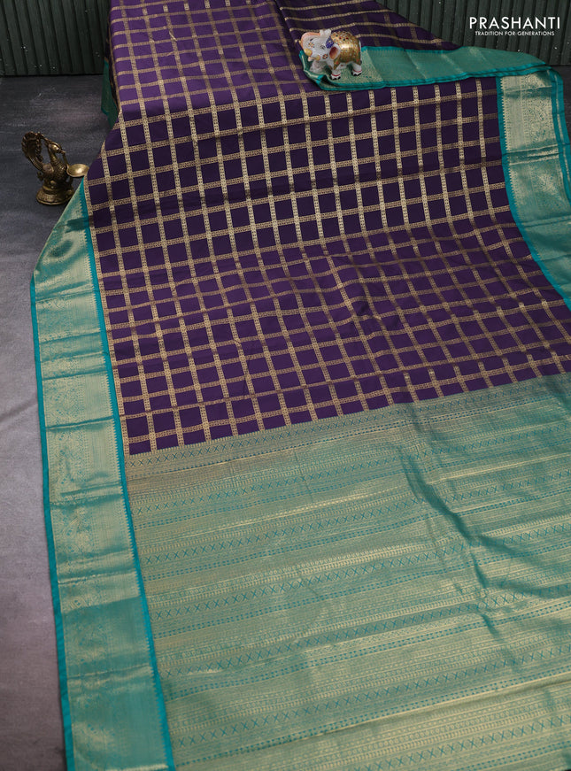 Semi kanchipuram silk saree deep purple and teal green with allover zari checked pattern and zari woven korvai border