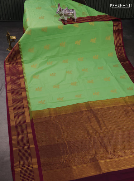 Semi kanchipuram silk saree pista green and magenta pink with zari woven buttas and zari woven border