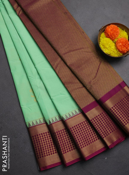 Semi kanchipuram silk saree teal green and magenta pink with zari woven buttas and zari woven korvai border