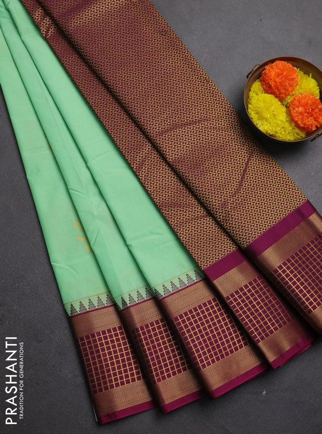 Semi kanchipuram silk saree teal green and magenta pink with zari woven buttas and zari woven korvai border