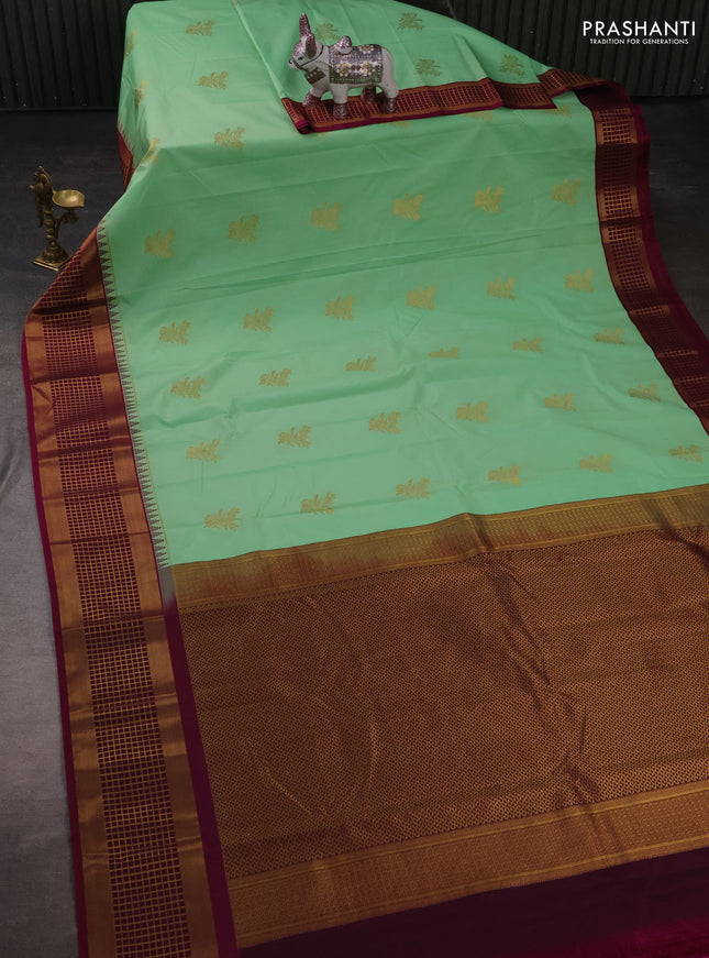 Semi kanchipuram silk saree teal green and magenta pink with zari woven buttas and zari woven korvai border