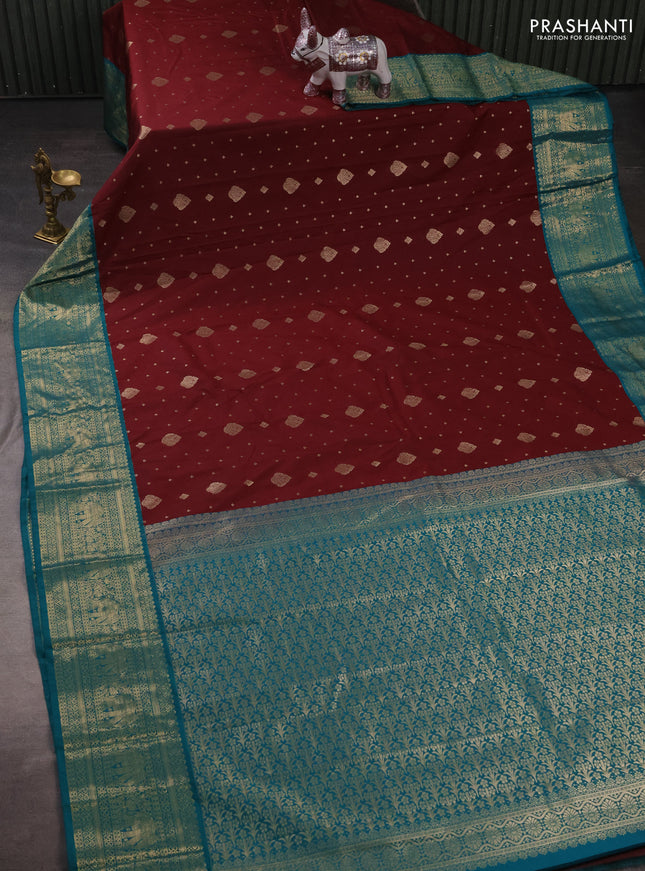 Semi kanchipuram silk saree maroon and teal green with allover zari woven buttas and zari woven korvai border