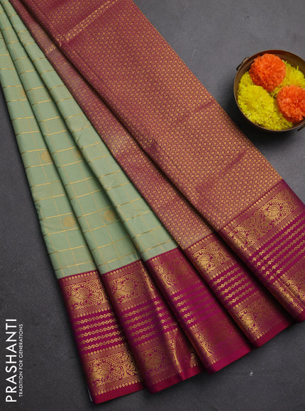 Semi kanchipuram silk saree pastel green and magenta pink with allover zari checks & buttas and long zari woven korvai border