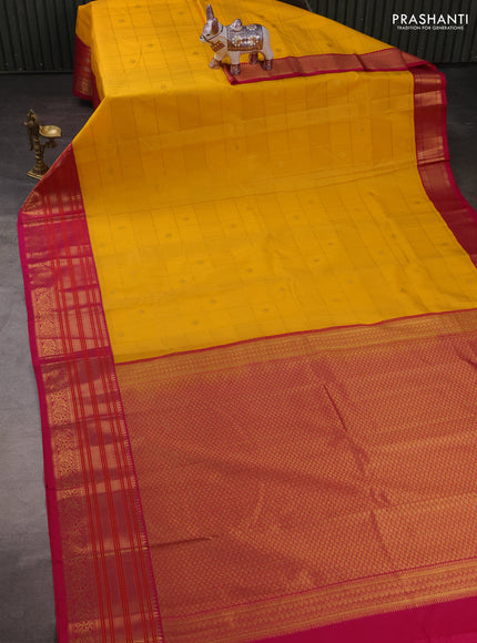 Semi kanchipuram silk saree yellow and pink with allover zari checks & buttas and long zari woven korvai border