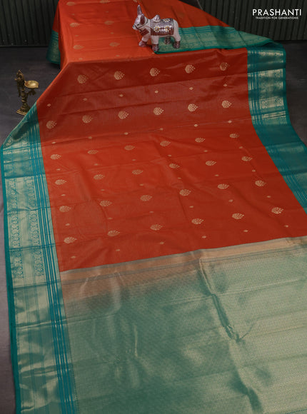 Semi kanchipuram silk saree rust shade and teal green with allover zari weaves & buttas and zari woven korvai border