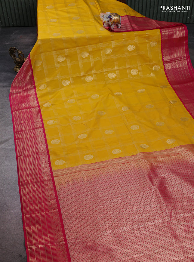 Semi kanchipuram silk saree yellow and pink with allover zari checks & buttas and zari woven korvai border