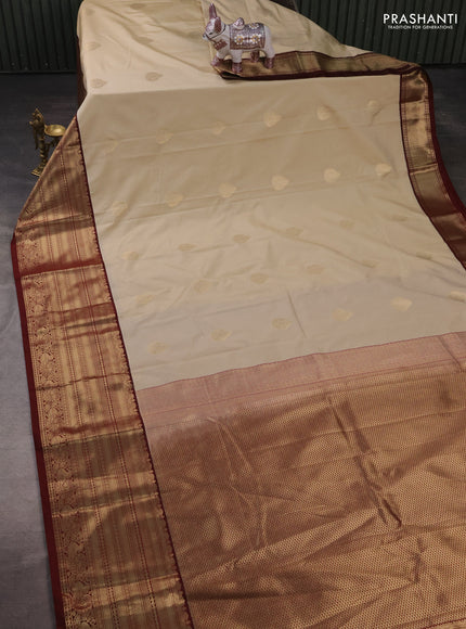 Semi kanchipuram silk saree beige and maroon with zari woven buttas and long zari woven korvai border