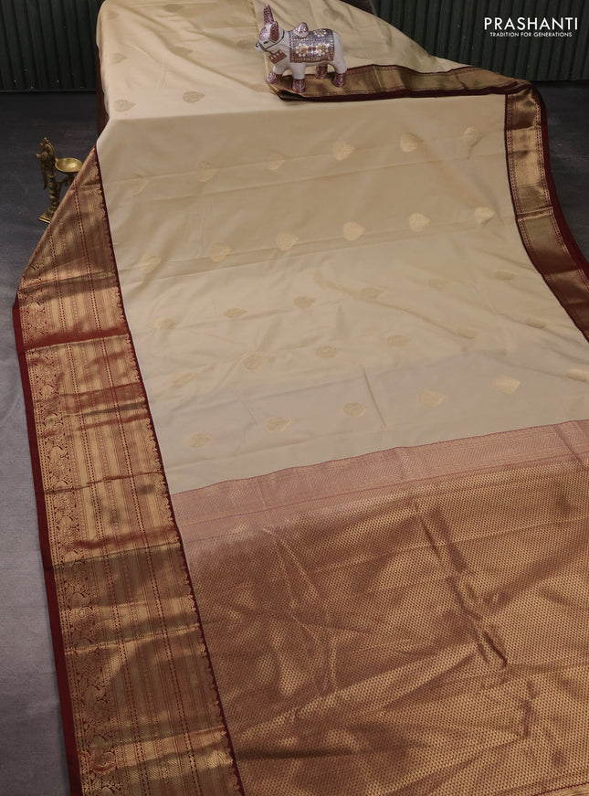 Semi kanchipuram silk saree beige and maroon with zari woven buttas and long zari woven korvai border