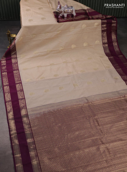 Semi kanchipuram silk saree beige and wine shade with allover zari checks & buttas and rettapet zari woven korvai border