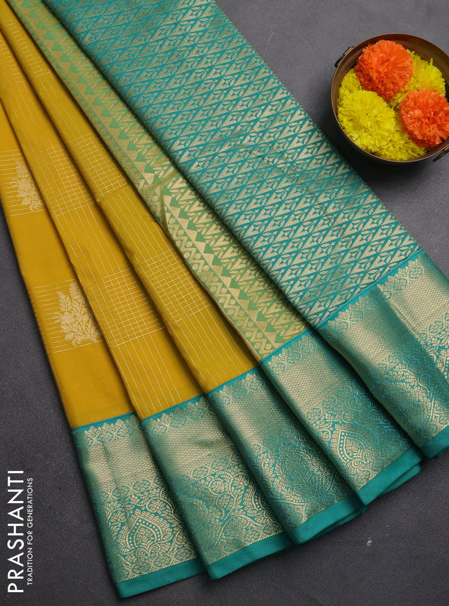 Semi kanchipuram silk saree mustard yellow and teal green with allover zari checks & buttas and zari woven korvai border