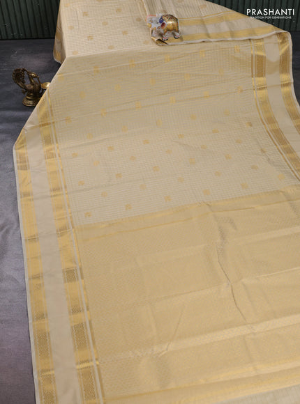 Semi kanchipuram silk saree sandal with allover zari checks & buttas and rettapet zari woven border