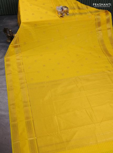 Semi kanchipuram silk saree yellow with allover zari checks & buttas and rettapet zari woven border