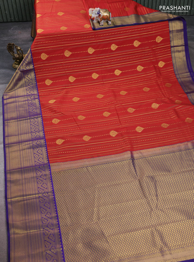 Semi kanchipuram silk saree rust shade and navy blue with allover zari weaves & buttas and long zari woven korvai border