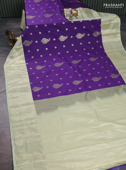 Semi kanchipuram silk saree purple and mild pista green with zari woven buttas and long zari woven korvai border
