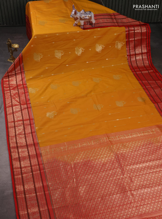 Semi kanchipuram silk saree mustard yellow and red with zari woven buttas and zari woven korvai border