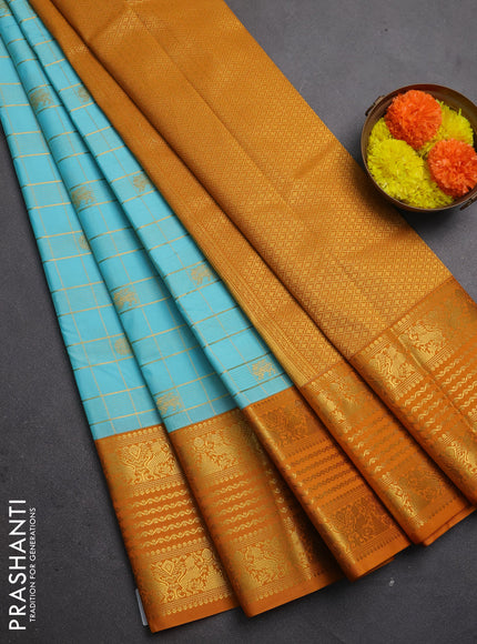 Semi kanchipuram silk saree teal blue and dark mustard with allover zari checks & buttas and long zari woven border
