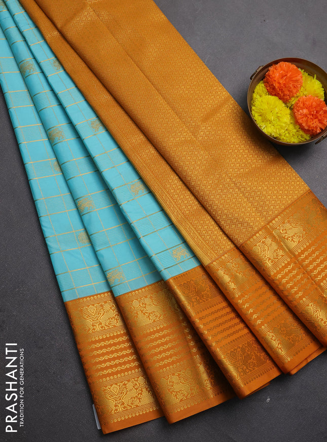 Semi kanchipuram silk saree teal blue and dark mustard with allover zari checks & buttas and long zari woven border