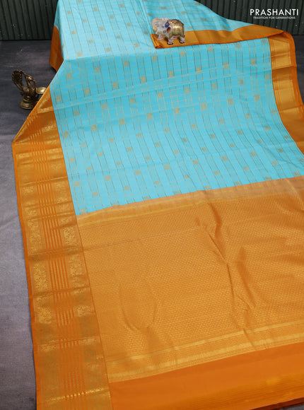 Semi kanchipuram silk saree teal blue and dark mustard with allover zari checks & buttas and long zari woven border
