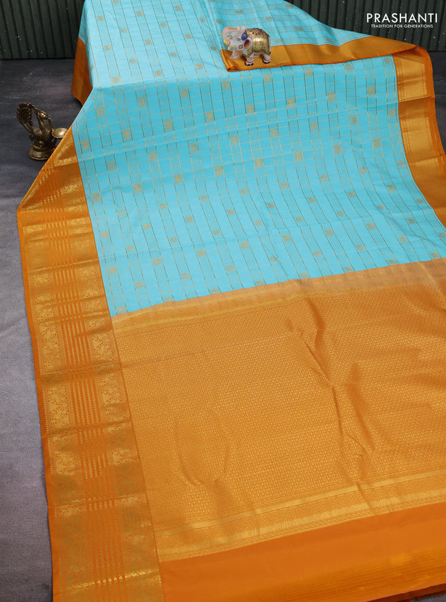 Semi kanchipuram silk saree teal blue and dark mustard with allover zari checks & buttas and long zari woven border