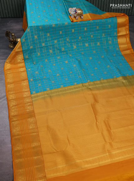 Semi kanchipuram silk saree dual shade of teal green and dark mustard with allover zari checks & buttas and long zari woven border