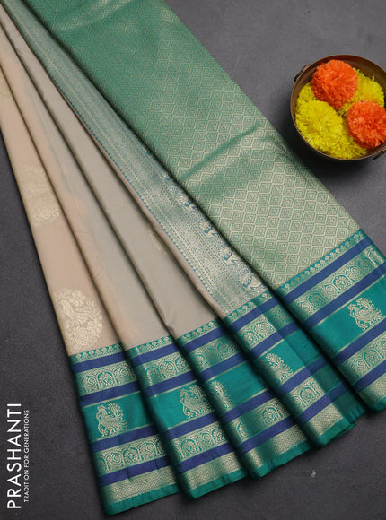 Semi kanchipuram silk saree beige and teal green with zari woven buttas and long zari woven korvai border