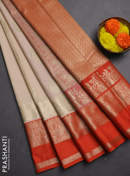 Semi kanchipuram silk saree beige and orange with zari woven buttas and long rettapet zari woven korvai border