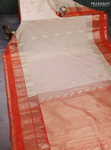 Semi kanchipuram silk saree beige and orange with zari woven buttas and long rettapet zari woven korvai border