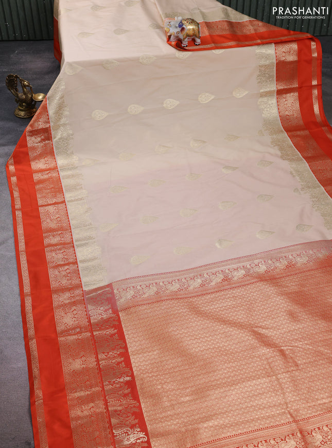 Semi kanchipuram silk saree beige and orange with zari woven buttas and long rettapet zari woven korvai border