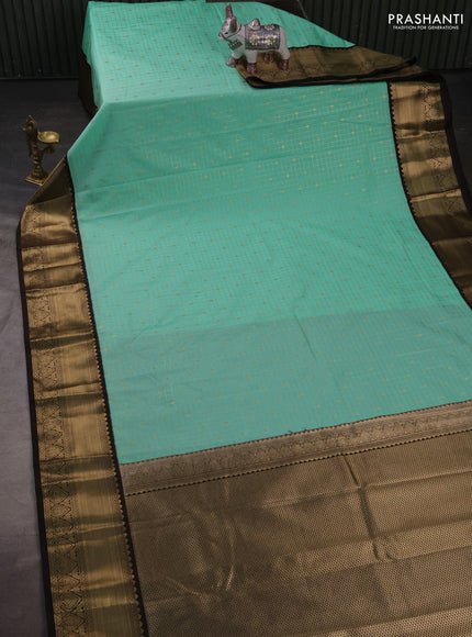 Semi kanchipuram silk saree mild teal and coffee brown with allover zari checks & buttas and rich zari woven korvai border